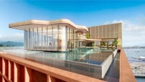 Rooftop infinity pool at The Bedrock Jesselton Docklands in Sabah by Exsim, offering panoramic views of the city and sea