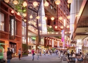 Vibrant festive street at The Bedrock Jesselton Docklands, Exsim’s Sabah development, featuring retail shops and dining spots.