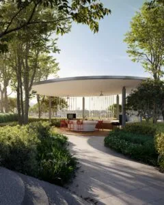 Outdoor grill and social dining pavilion at The Lighthauz surrounded by landscaped greenery.