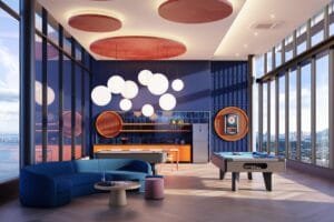 Indoor entertainment lounge at The Lighthauz with pool table, seating area and bright interior design.