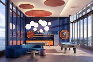 Indoor entertainment lounge at The Lighthauz with pool table, seating area and bright interior design.