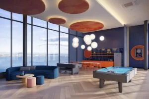 Games lounge at The Lighthauz with pool table, dining counter and panoramic Penang view.