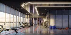 Indoor fitness zone at The Lighthauz with cardio machines, weights and bright window views.