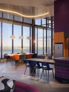Horizon lounge at The Lighthauz with dining area, sea view windows and warm interior lighting.