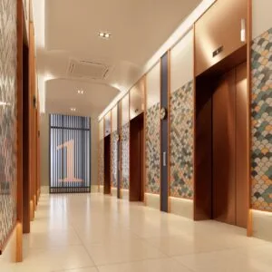 Lift lobby area at The Lighthauz with decorative wall panels and warm lighting design.
