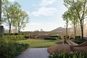 Outdoor stargazing deck at The Lighthauz with hammock seating, landscaped garden and sunset view.