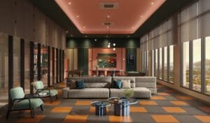Games lounge at Keeperz Suites with pool table, sofa seating and city view windows.