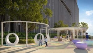 Podium playground at Keeperz Suites with play structures, soft landscaping and family-friendly outdoor space.