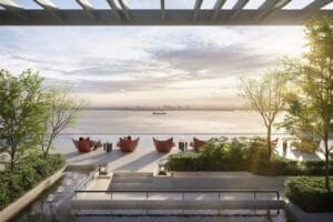 Sunken oasis at Keeperz Suites with lounge chairs, water feature and landscaped sea-facing relaxation area.