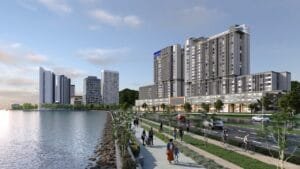 Keeperz Suites facade view with landscaped waterfront promenade and surrounding high-rise developments in Penang.